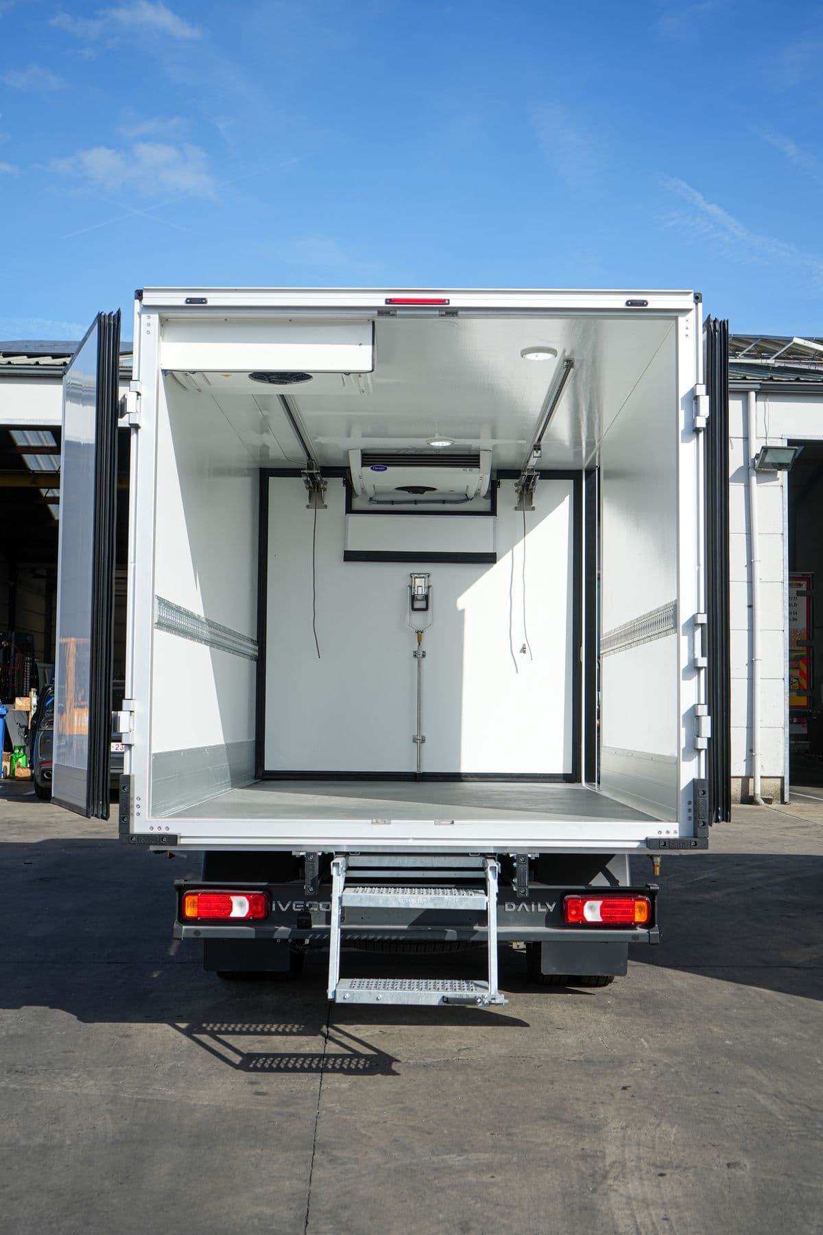 The open rear doors of an Isocar box, showing the load space and the step