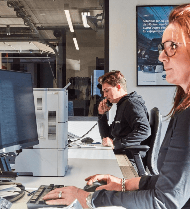 Two Westcool staff at work in the sales office