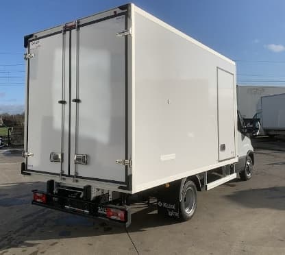 The rear of a chassis cab with a new insulated box body and a tail lift